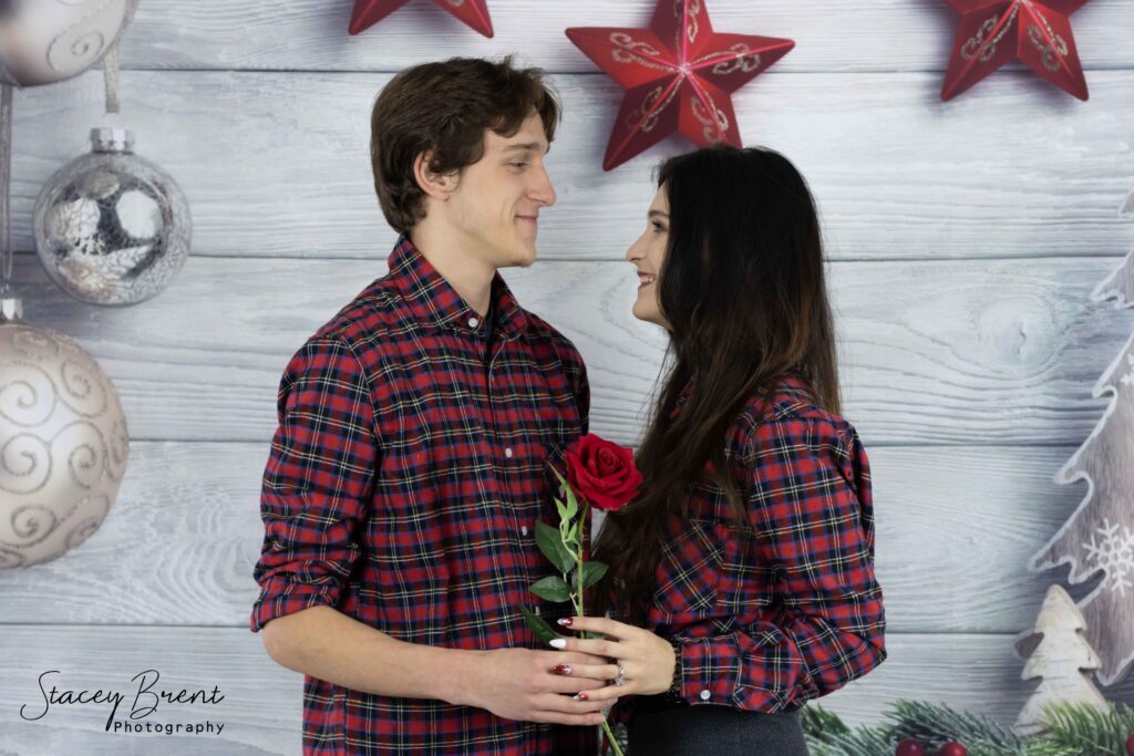 Couples Christmas card with rose in studio. Stacey Brent Photography, Central Newfoundland.