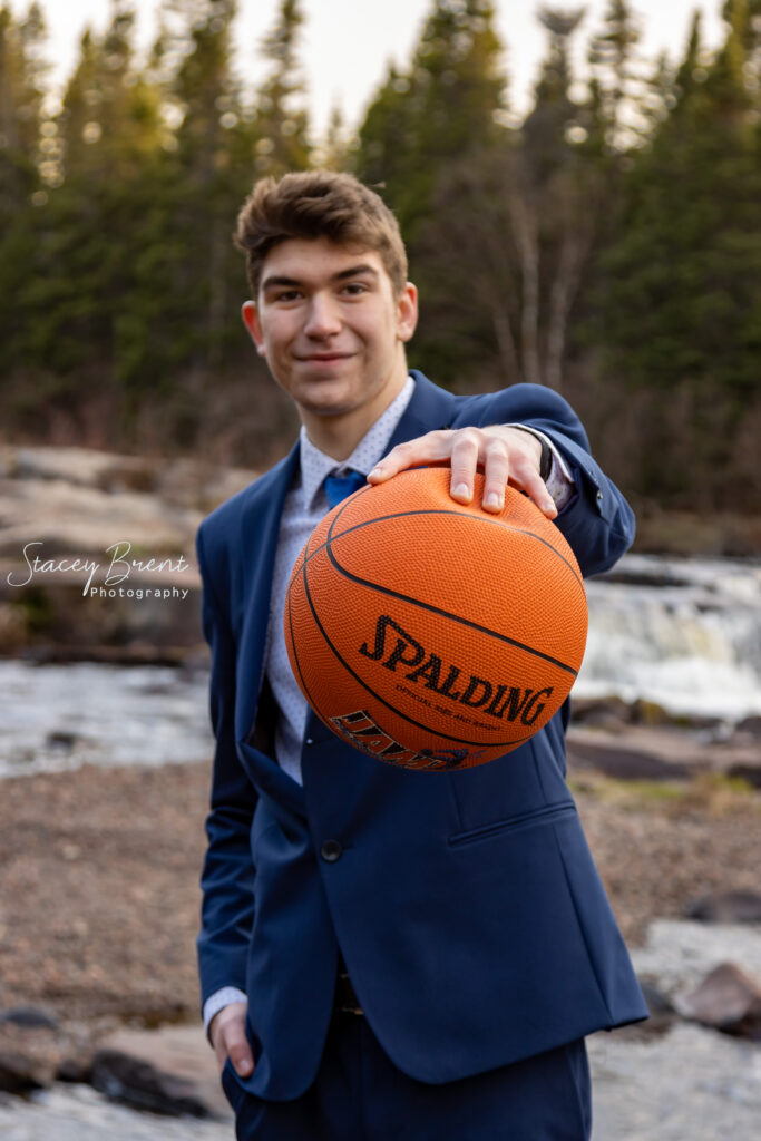 Senior Graduate with Basketball. Stacey Brent Photography, Central Newfoundland.