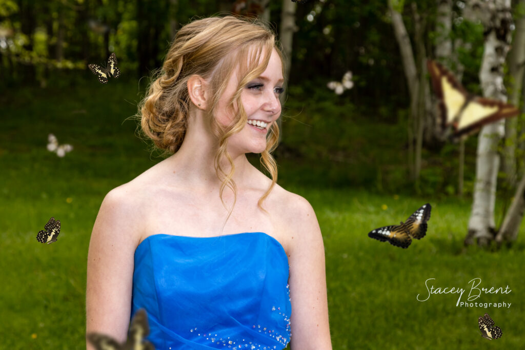 Senior Graduate with butterflies. Stacey Brent Photography, Central Newfoundland.