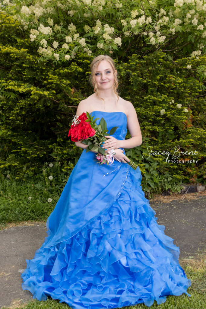 Senior Graduate with flowers. Stacey Brent Photography, Central Newfoundland.